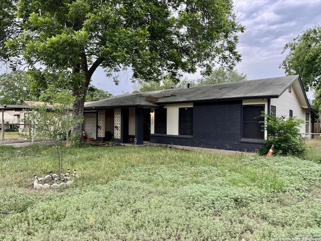 5039 Bayhead, San Antonio, TX 78220 - view of front of house with an attached garage, brick siding, and roof with shingles