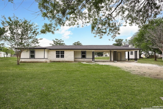 8160E 6th St, Somerset, TX 78069 - single story home featuring a front yard, a carport, dirt driveway, stone siding, and board and batten siding