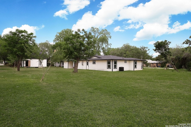 8160E 6th St, Somerset, TX 78069 - rear view of property with a yard and central AC unit