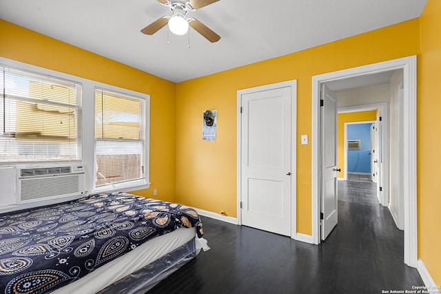 706 El Monte Blvd, San Antonio, TX 78212 - bedroom featuring baseboards, dark wood-type flooring, cooling unit, and ceiling fan
