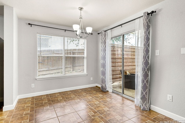 846 Barrel Pt, San Antonio, TX 78251 - unfurnished dining area featuring a chandelier and baseboards