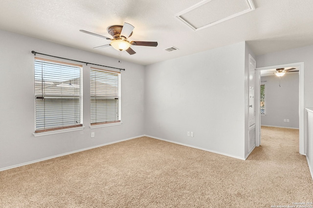 846 Barrel Pt, San Antonio, TX 78251 - empty room with attic access, a ceiling fan, light carpet, and baseboards
