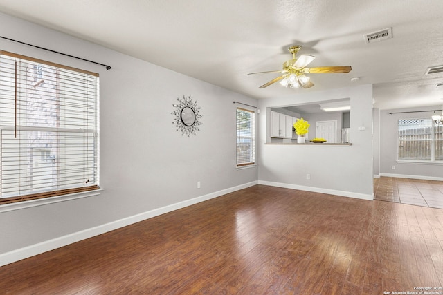 846 Barrel Pt, San Antonio, TX 78251 - spare room featuring a ceiling fan, baseboards, and wood finished floors