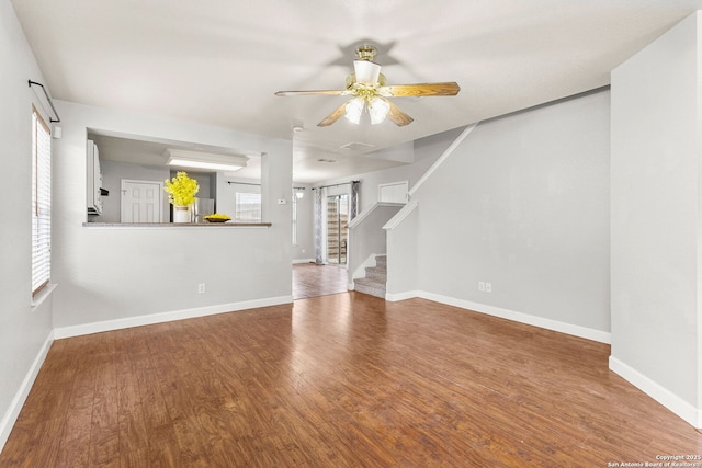846 Barrel Pt, San Antonio, TX 78251 - unfurnished living room featuring wood finished floors, stairway, ceiling fan, and baseboards