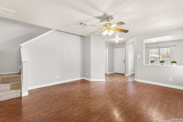 846 Barrel Pt, San Antonio, TX 78251 - unfurnished living room with ceiling fan, stairs, wood finished floors, and baseboards