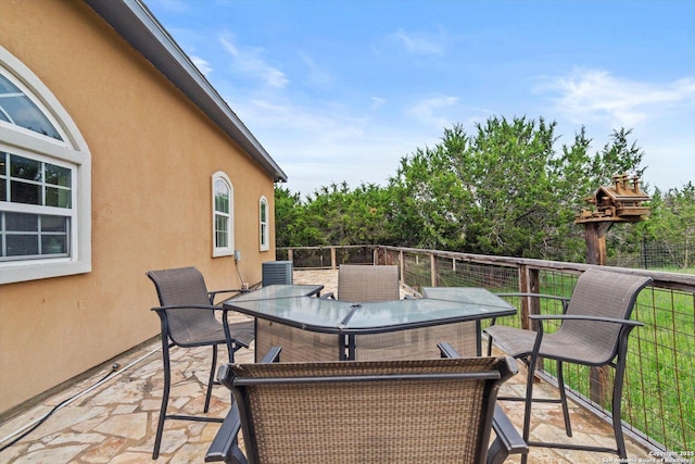 3205 Puter Crk, Spring Branch, TX 78070 - view of patio / terrace with outdoor dining space and central AC unit