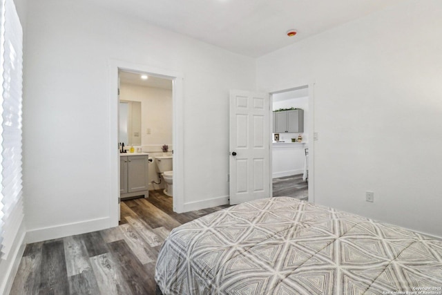 2120 San Fernando, San Antonio, TX 78207 - bedroom featuring wood finished floors, connected bathroom, and baseboards