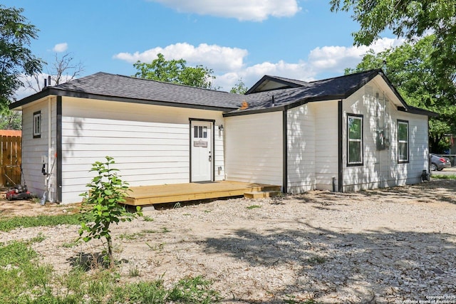 2120 San Fernando, San Antonio, TX 78207 - rear view of property featuring a wooden deck and a shingled roof