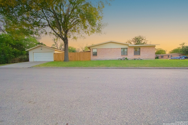 view of front of home with concrete driveway and brick siding