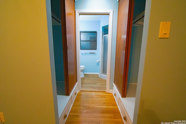 hallway with light wood finished floors