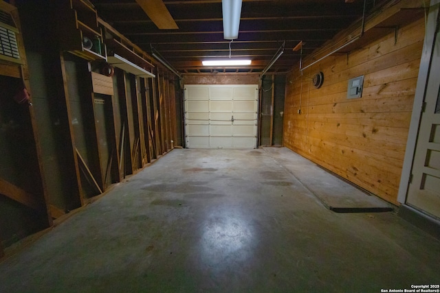 garage featuring wooden walls