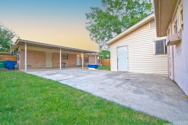 view of garage at dusk