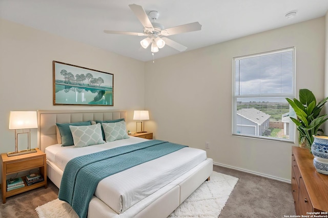 bedroom with carpet floors, baseboards, and ceiling fan