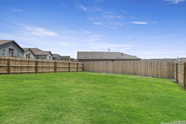 view of yard featuring a residential view
