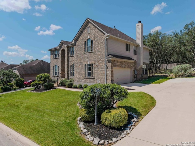 view of front of property with an attached garage, driveway, brick siding, and a chimney
