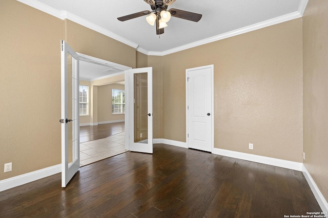 unfurnished room featuring french doors, crown molding, hardwood / wood-style floors, a ceiling fan, and baseboards