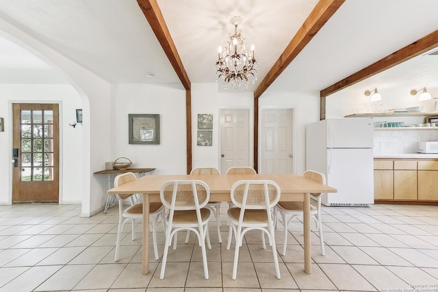 dining room with beam ceiling, light tile patterned floors, arched walkways, and a chandelier