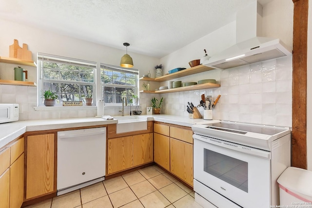 kitchen with open shelves, white appliances, wall chimney exhaust hood, a sink, and decorative backsplash