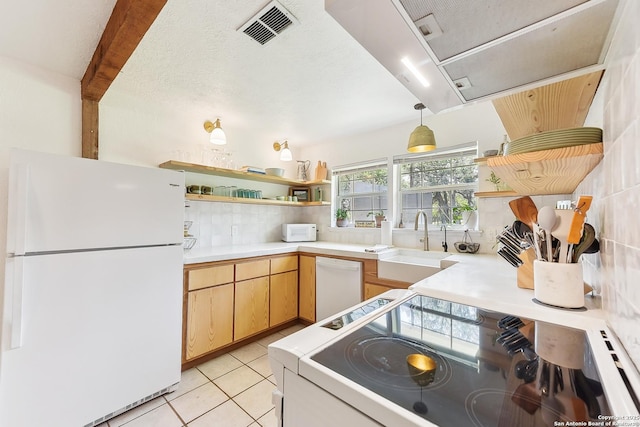 kitchen featuring white appliances, open shelves, a sink, and backsplash