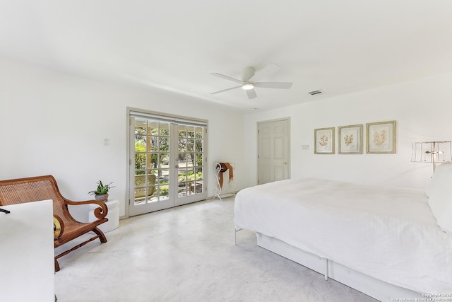 bedroom with access to outside, concrete floors, and a ceiling fan