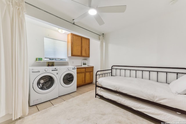 clothes washing area with cabinet space, separate washer and dryer, light tile patterned floors, and ceiling fan