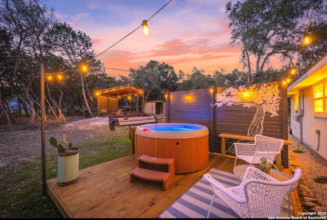 wooden terrace featuring a hot tub