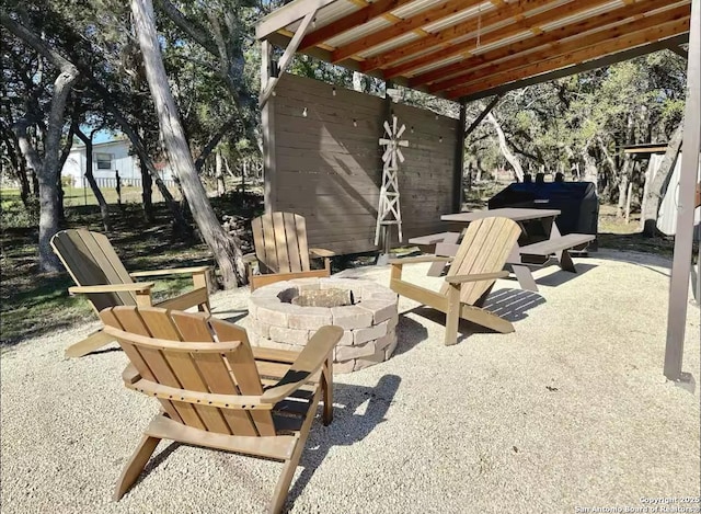 view of patio / terrace with an outdoor fire pit
