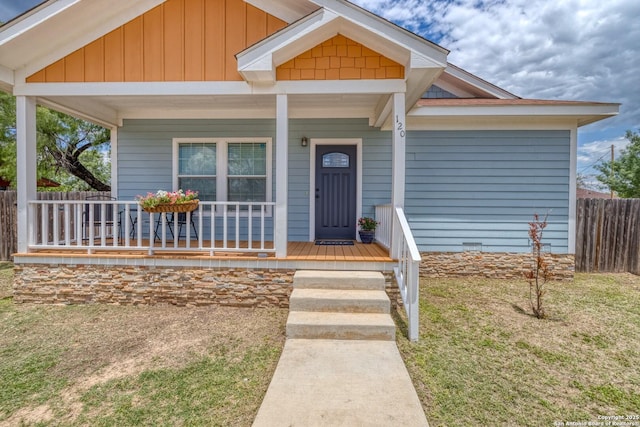 120 W Brazos, Uvalde, TX 78801 - view of front facade featuring a porch and board and batten siding