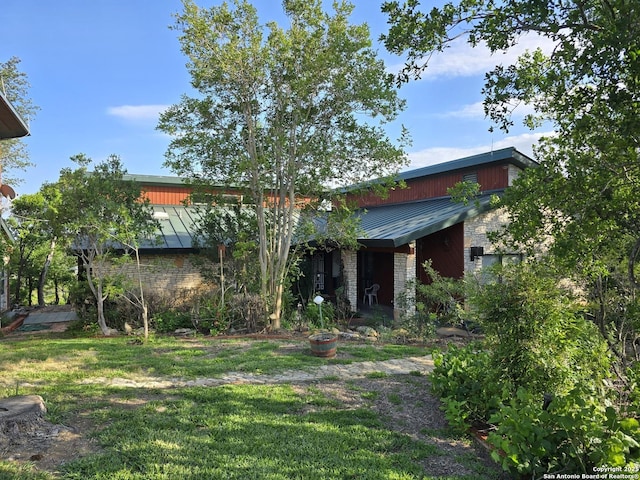 9840 Tower Vw, Helotes, TX 78023 - rear view of house with a lawn and metal roof