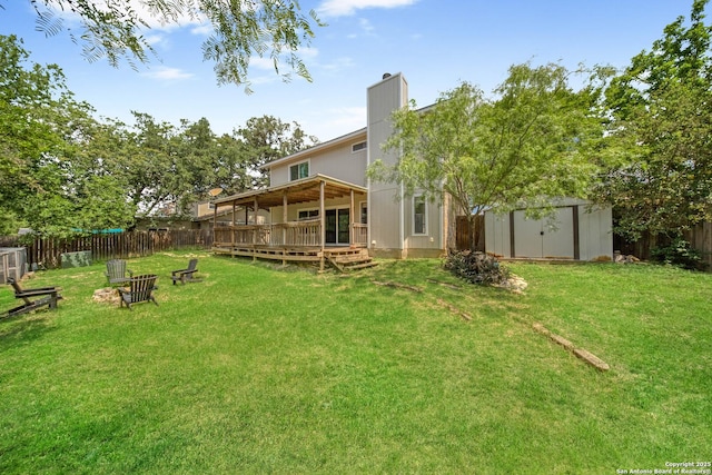 8201 Bluff Bnd, San Antonio, TX 78250 - back of house with a storage shed, a wooden deck, an outdoor structure, and a chimney