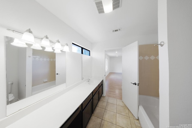 8201 Bluff Bnd, San Antonio, TX 78250 - full bath with tile patterned flooring, toilet, and vanity