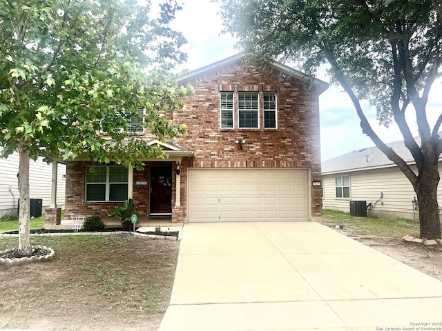 view of front of house with brick siding, a garage, driveway, and cooling unit