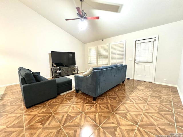 living room featuring ceiling fan, baseboards, and high vaulted ceiling