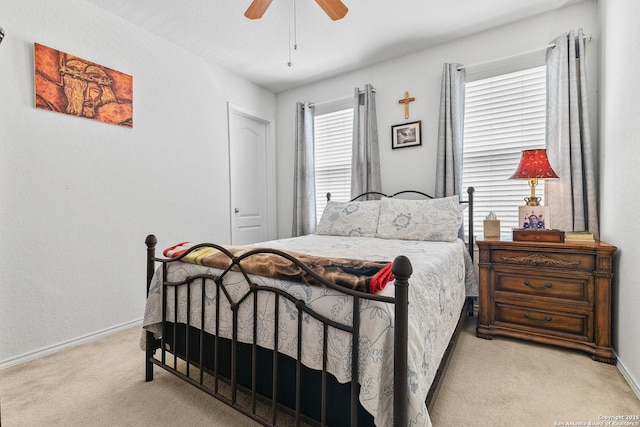 bedroom with carpet floors, baseboards, and ceiling fan