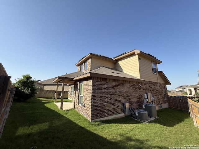 15319 Comanche, San Antonio, TX 78233 - back of property featuring brick siding and central AC