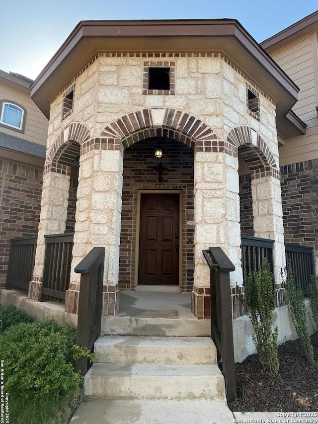 15319 Comanche, San Antonio, TX 78233 - entrance to property featuring brick siding and stone siding