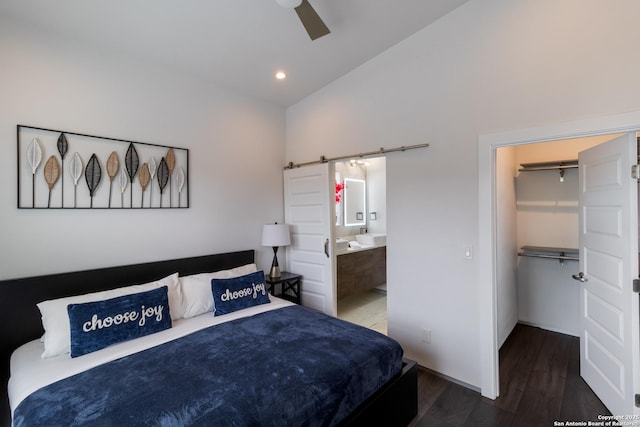 225 S Pine Unit 101, San Antonio, TX 78203 - bedroom with a barn door, wood finished floors, a spacious closet, connected bathroom, and recessed lighting