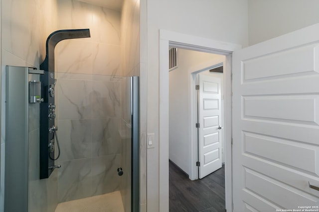 225 S Pine Unit 101, San Antonio, TX 78203 - full bathroom with a stall shower and wood finished floors