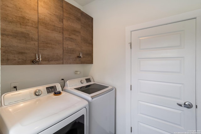 225 S Pine Unit 101, San Antonio, TX 78203 - clothes washing area with washing machine and dryer and cabinet space