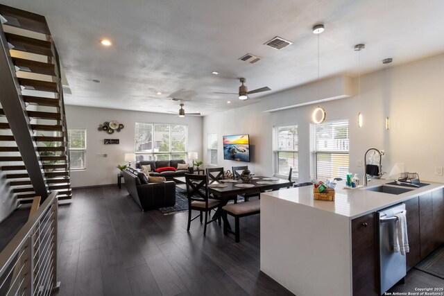 225 S Pine Unit 101, San Antonio, TX 78203 - kitchen featuring stainless steel dishwasher, a sink, light countertops, pendant lighting, and recessed lighting