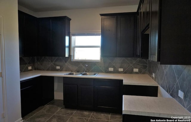 7374 Braes Cor, San Antonio, TX 78244 - kitchen featuring a sink, tasteful backsplash, and light countertops