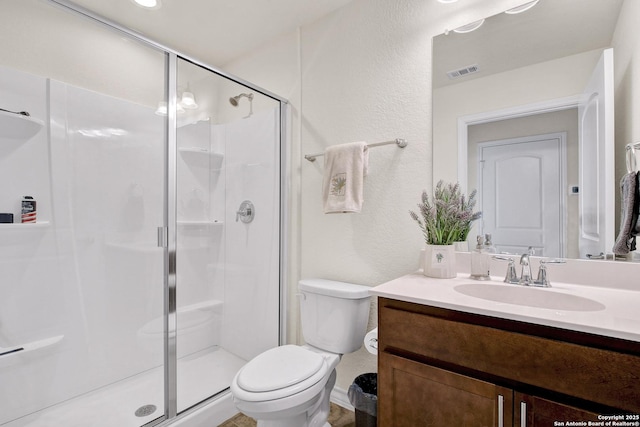 13227 Cache Crk, San Antonio, TX 78253 - full bathroom with a shower stall, vanity, toilet, and a textured wall