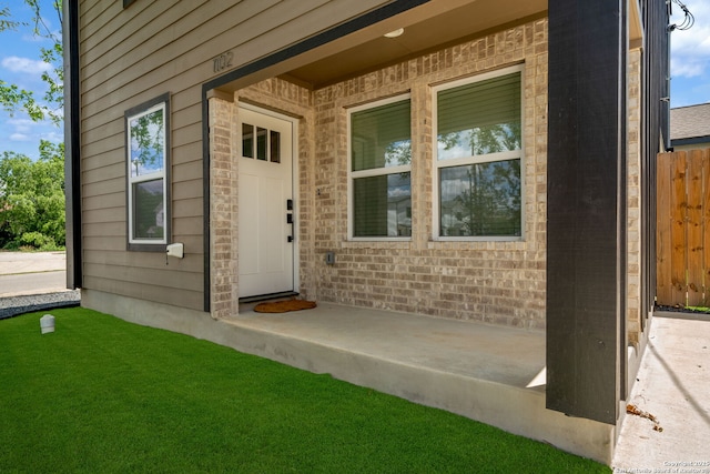 1108 S Gevers St, San Antonio, TX 78203 - view of exterior entry with brick siding and fence