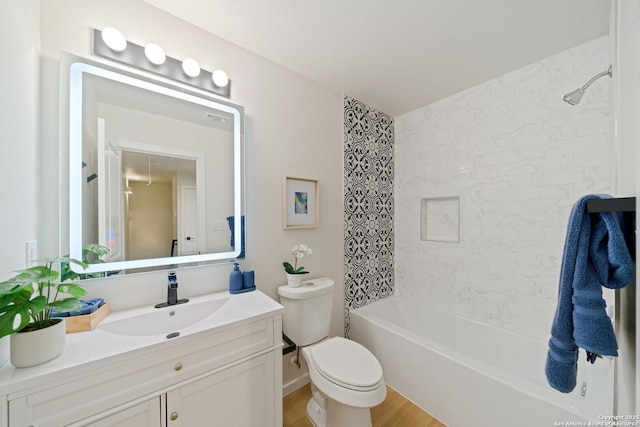 1108 S Gevers St, San Antonio, TX 78203 - bathroom with toilet, vanity, shower / tub combination, and wood finished floors