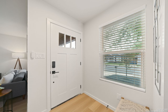 1108 S Gevers St, San Antonio, TX 78203 - foyer entrance featuring light wood-style floors, healthy amount of natural light, and baseboards