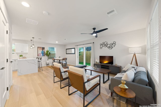 1108 S Gevers St, San Antonio, TX 78203 - living area with healthy amount of natural light, recessed lighting, a ceiling fan, and light wood-style flooring