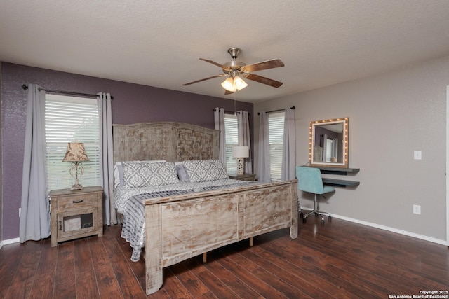 1026 Dogleg Right, San Antonio, TX 78221 - bedroom with baseboards, wood finished floors, ceiling fan, and a textured ceiling