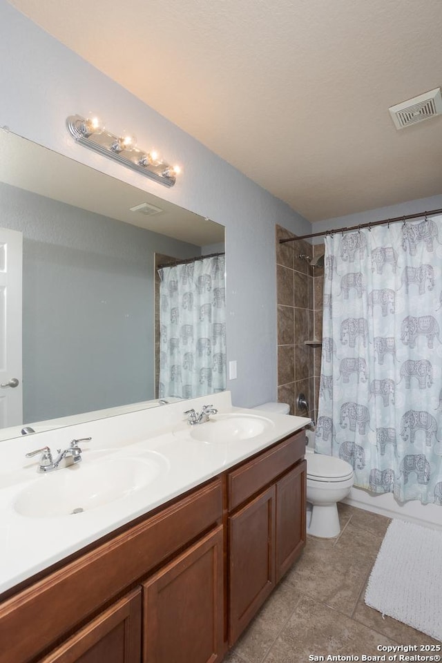 1026 Dogleg Right, San Antonio, TX 78221 - bathroom with toilet, double vanity, tile patterned flooring, and shower / bathtub combination with curtain