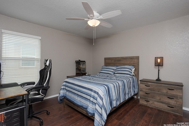 1026 Dogleg Right, San Antonio, TX 78221 - bedroom with wood-type flooring, baseboards, a desk, a textured ceiling, and ceiling fan