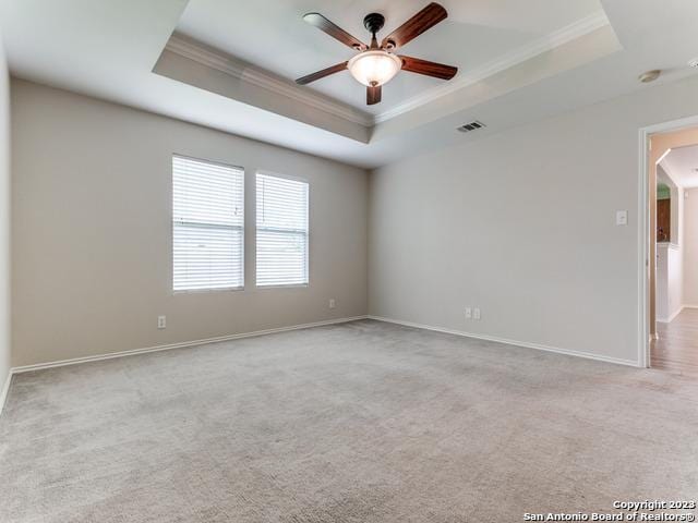 1818 Vinca Mnr, San Antonio, TX 78260 - empty room featuring crown molding, a tray ceiling, ceiling fan, carpet flooring, and baseboards